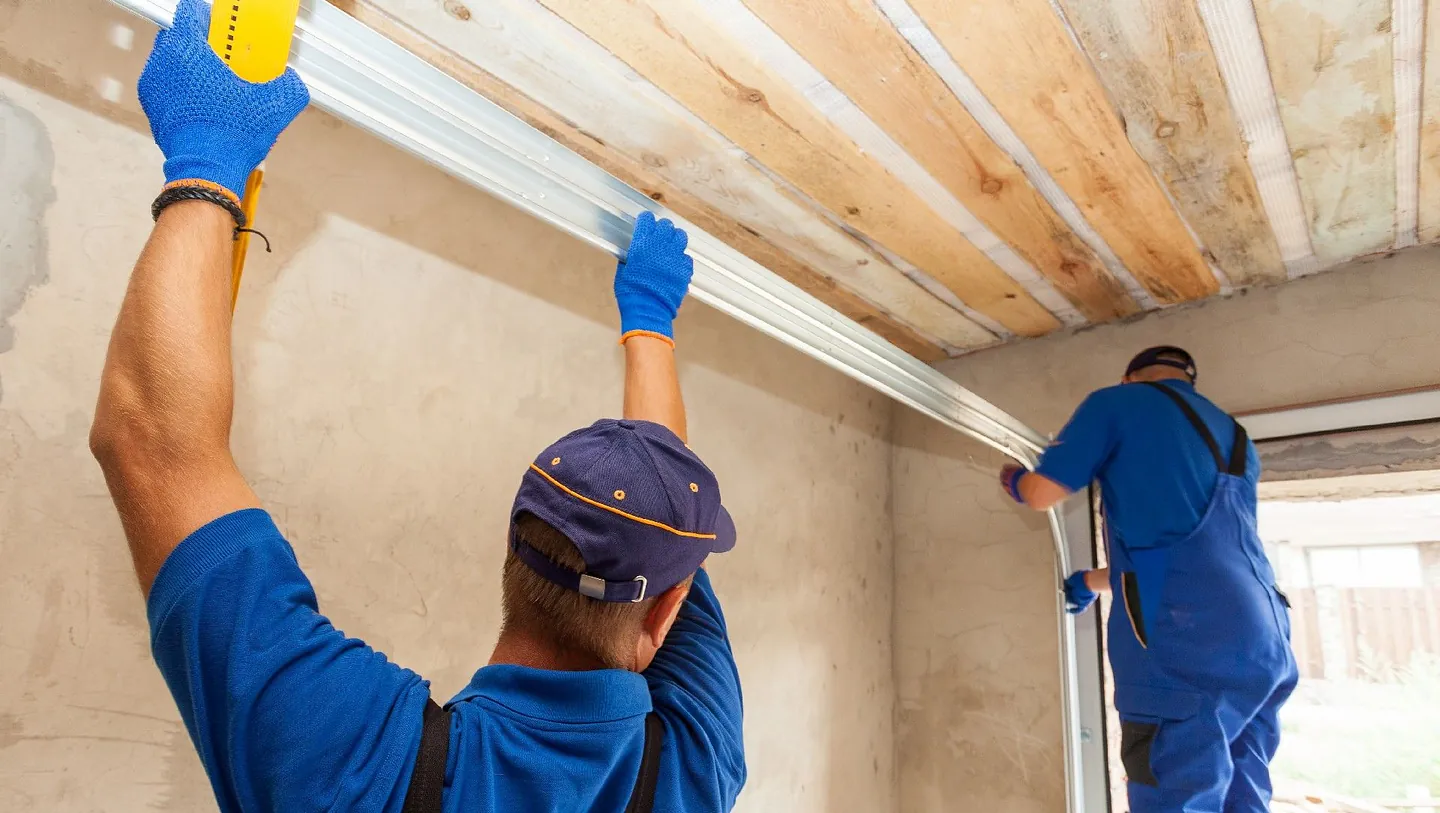 Some of our team repairing a clients garage door